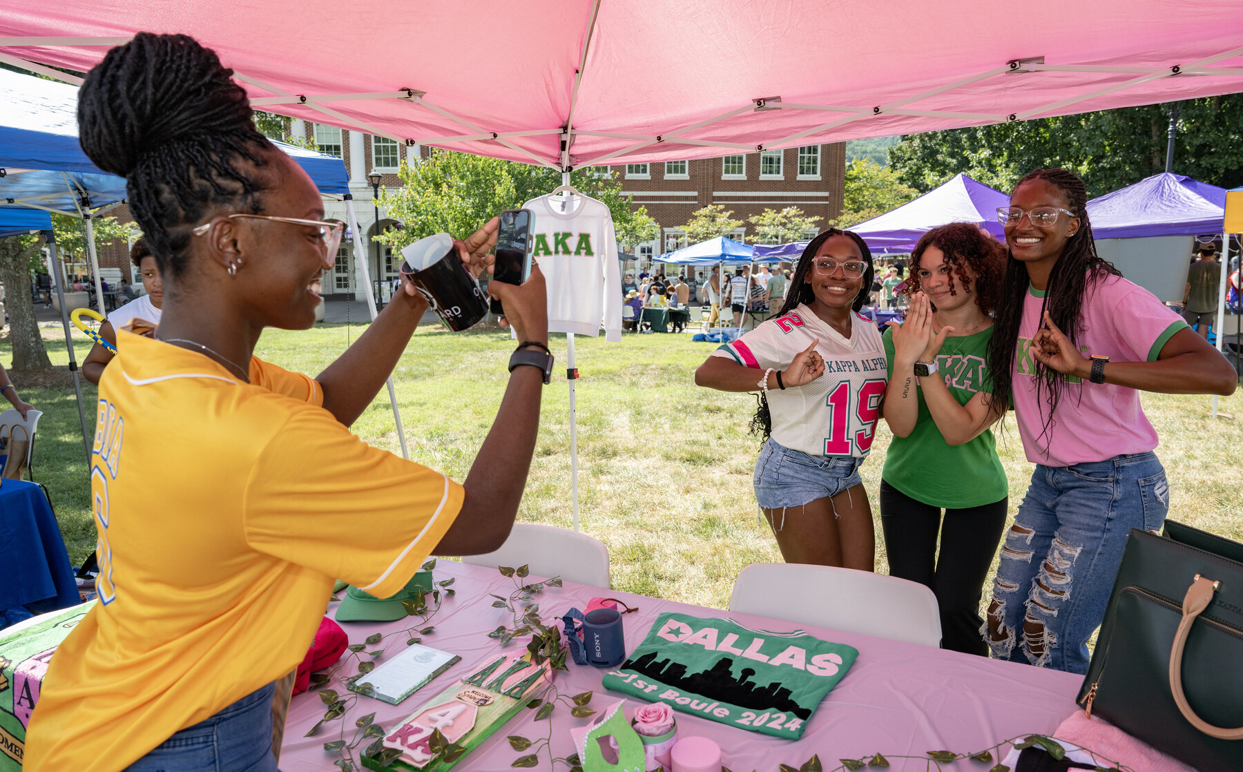 students tabling and posing for photo at Valley Ballyhoo