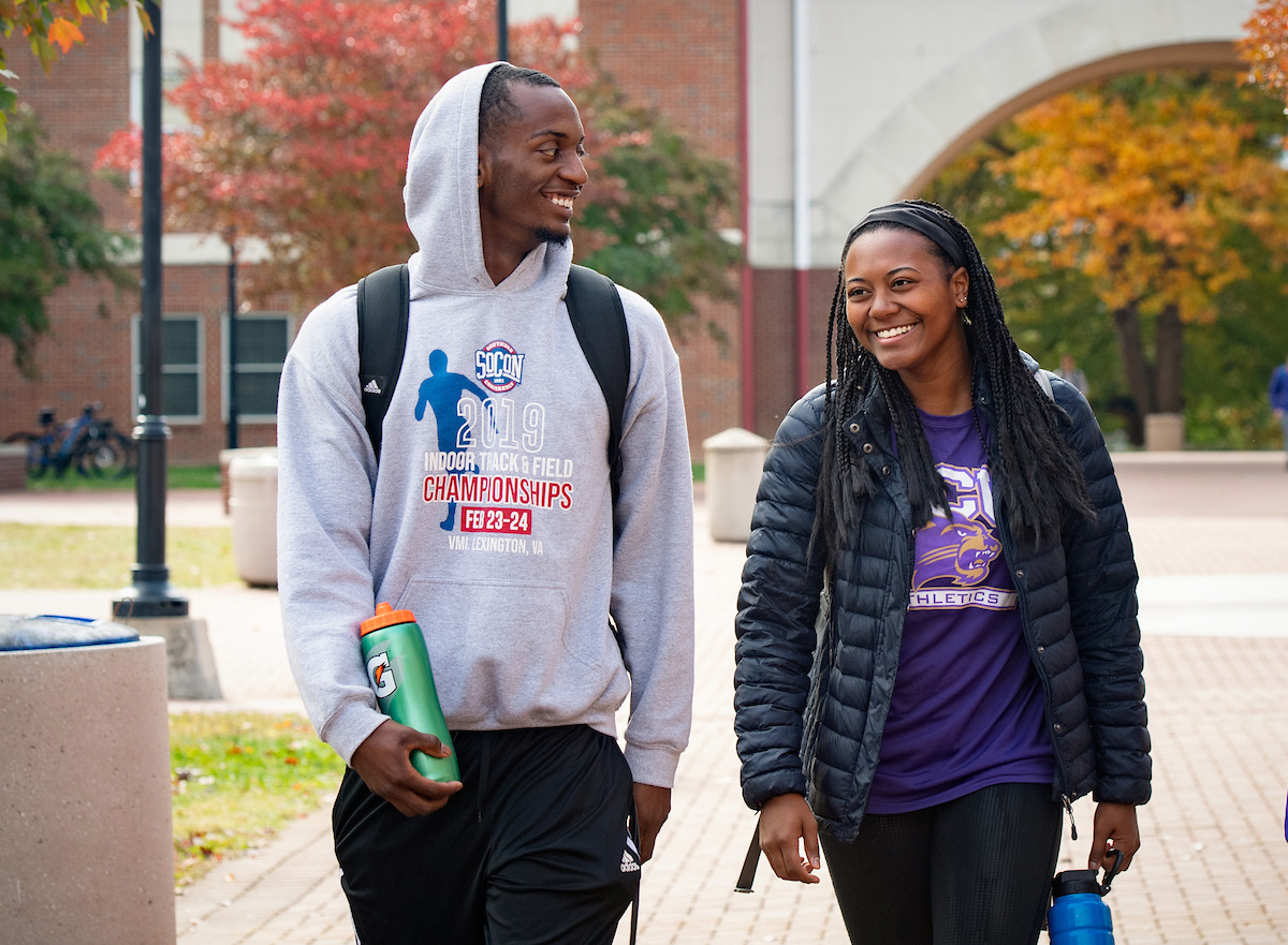 students walking through campus