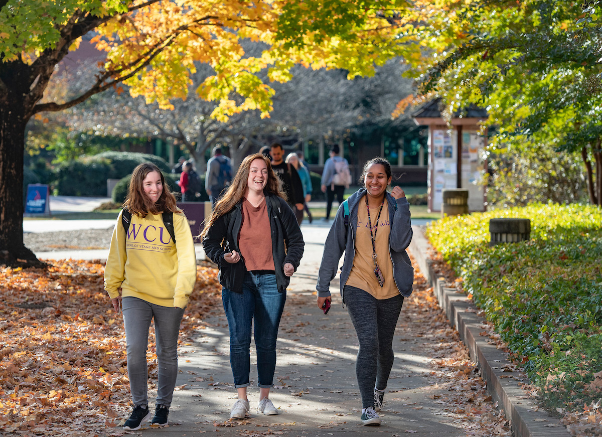 students walking through campus