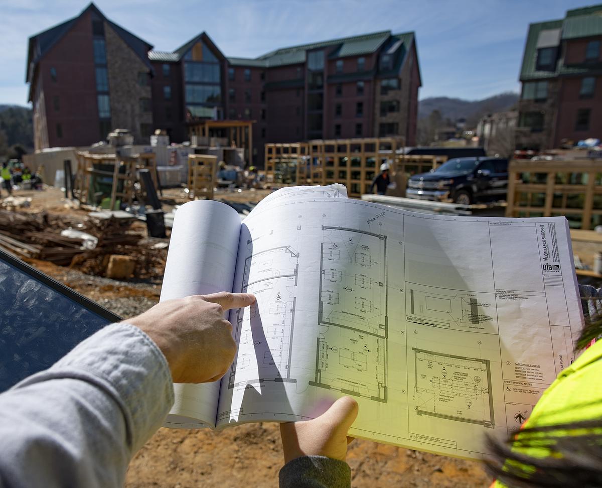 Student reviews construction plans