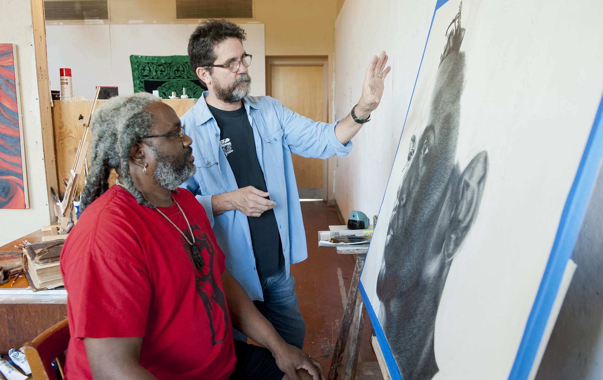 M.F.A. Program at WCU Classroom teacher and student discussing art.