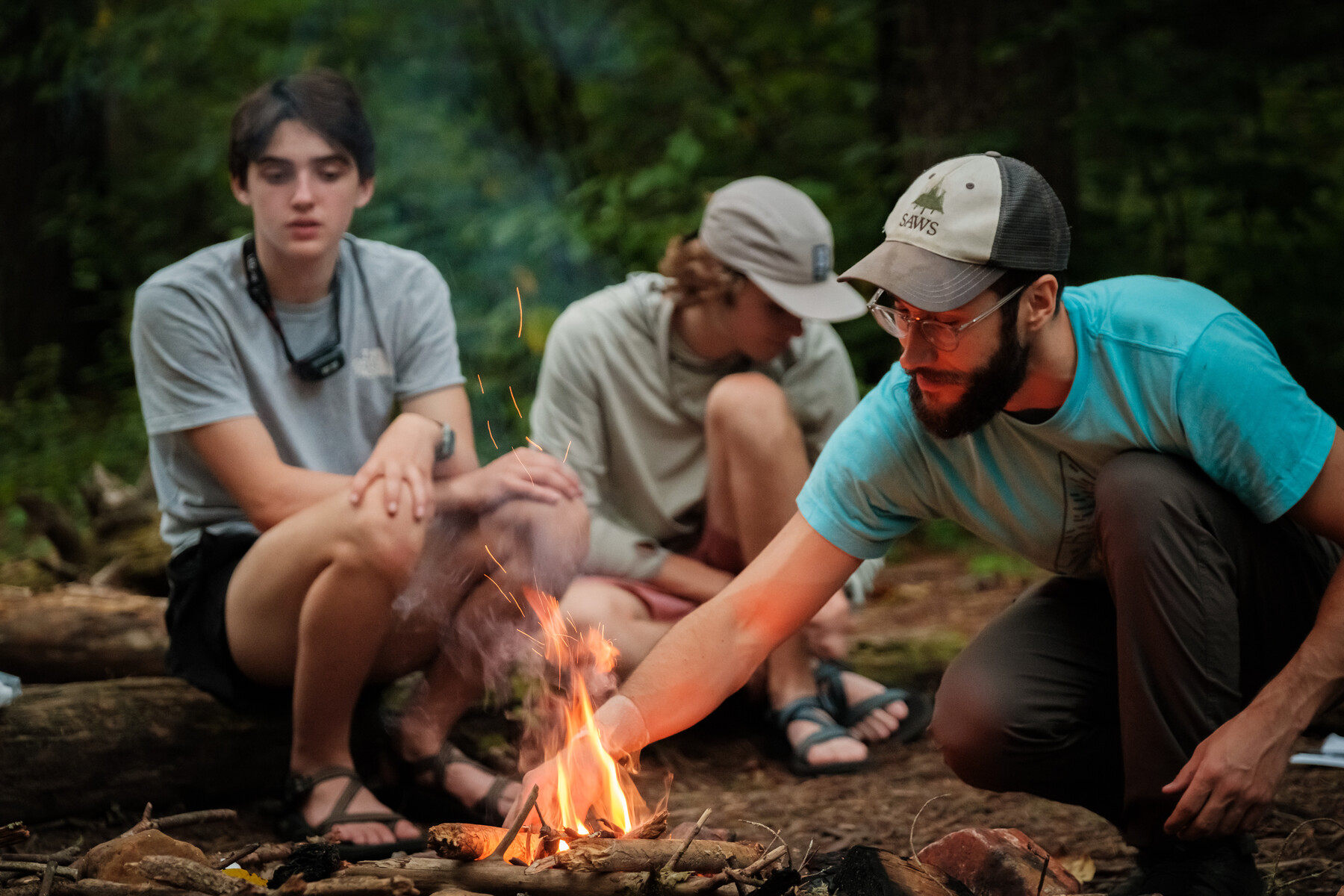 students around a camp fire