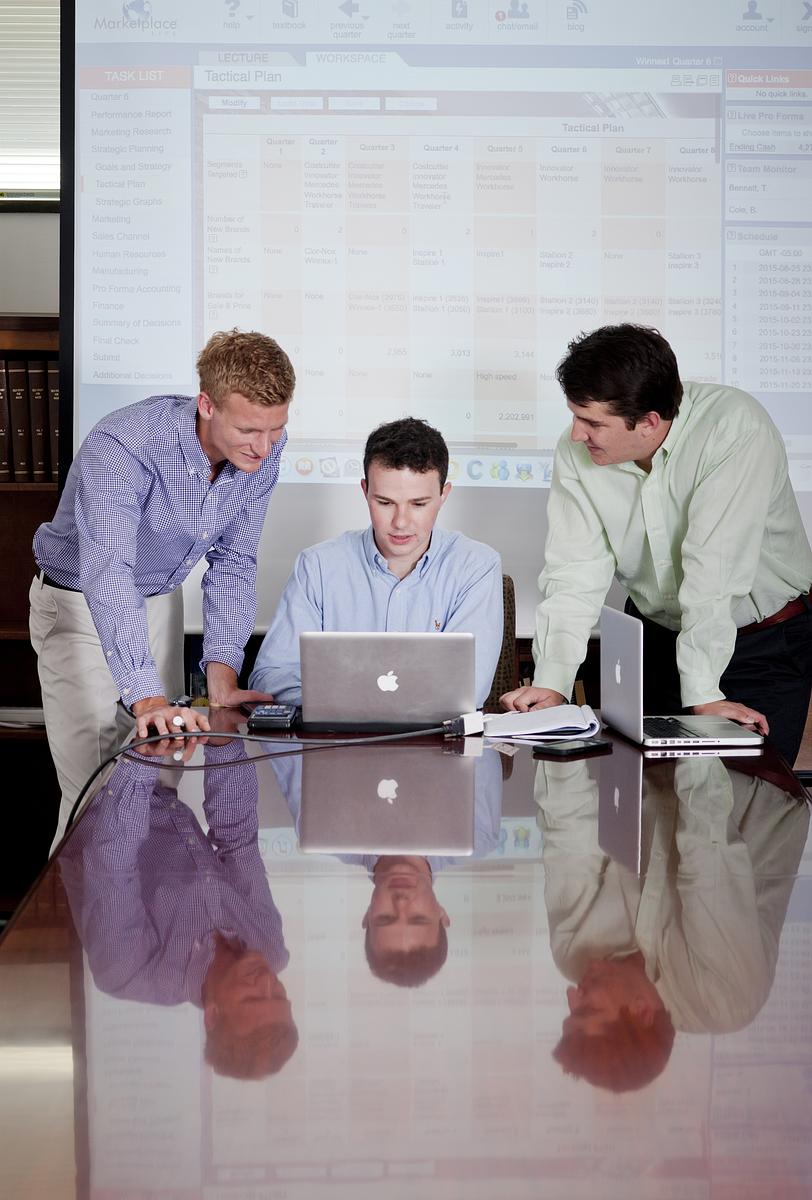 students looking at a laptop