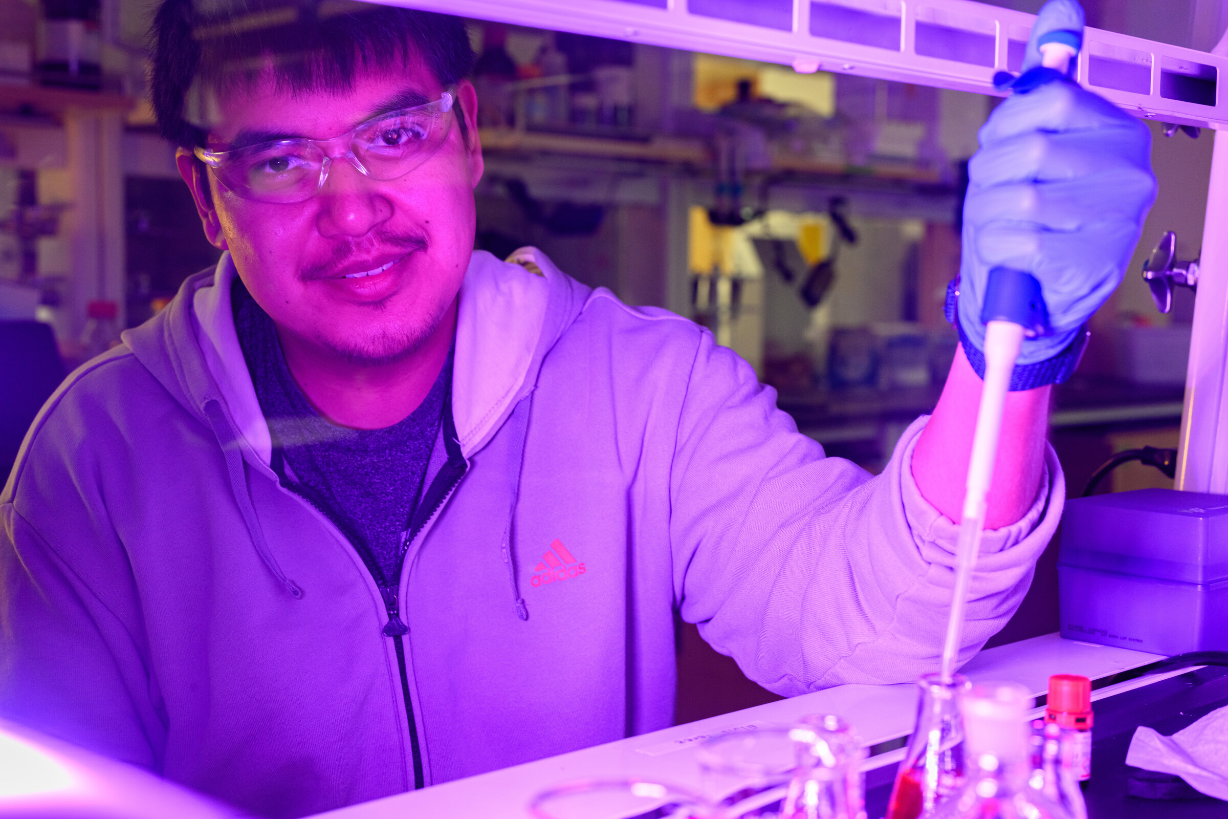 student and professor working on research