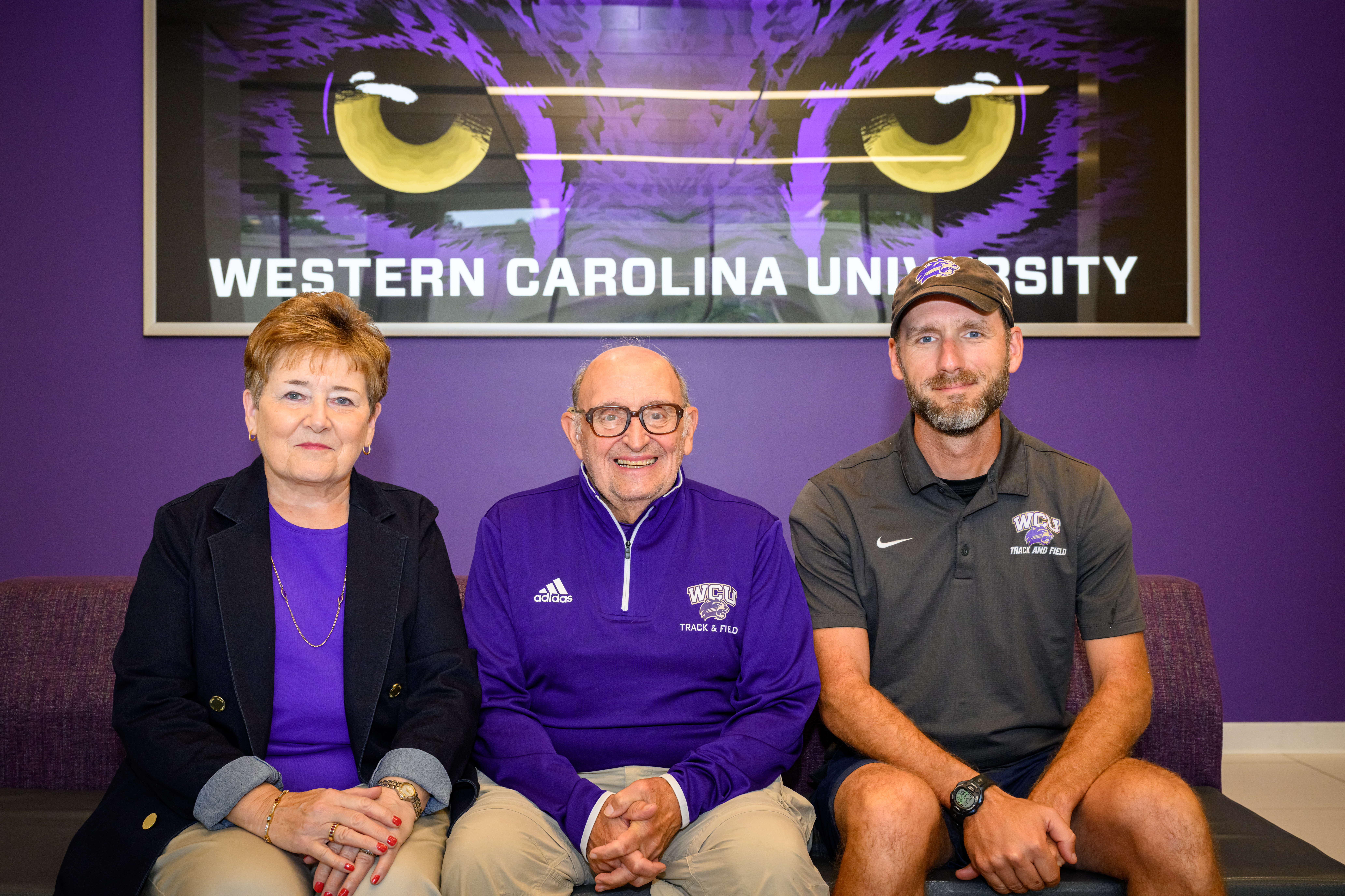 From right, Western Carolina University track and field and cross country coach Jesse Norman meets with donors Andrew and LouAnn Smith, who have created an endowment to support the programs.